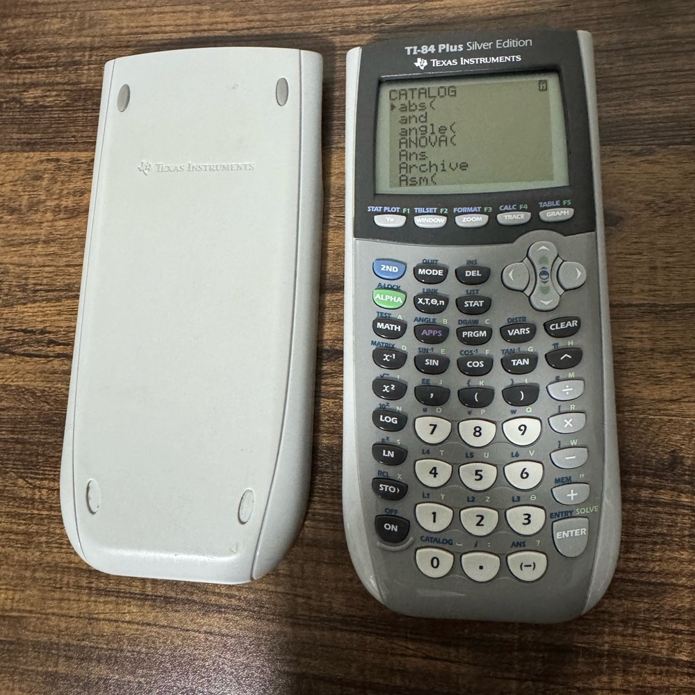 Texas Instruments TI-84 Plus Silver Edition Graphing Calculator - Gray and White